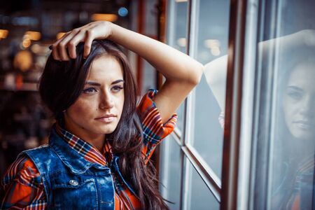 portrait of a girl at the windowの写真素材