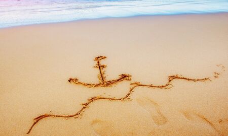 Figures in the sand on the beach.の写真素材