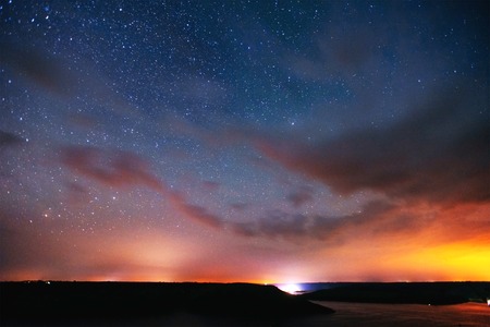 fantastic winter meteor shower and the snow-capped mountainsの写真素材