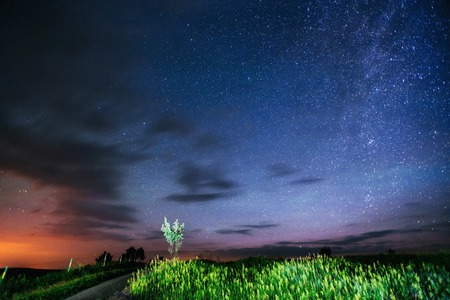 fantastic meteor shower and the snow-capped mountainsの写真素材