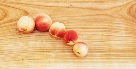 Beautiful sweet ripe apricots on wooden board.の写真素材