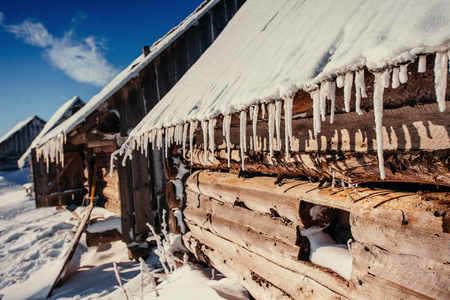 cabin in the mountains in winterの写真素材