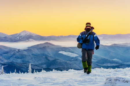 tourist in winter mountainsの写真素材