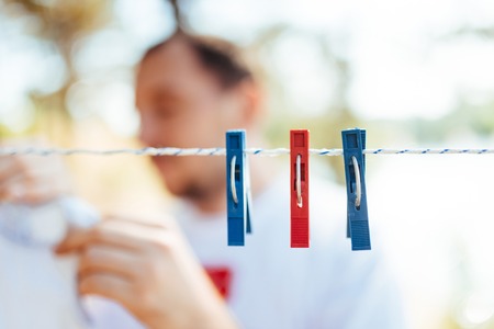 Clothspin. childrens clothing for girls outdoors in the gardenの写真素材