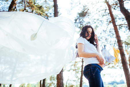 Pregnant Woman holding her hands on  stomachの写真素材