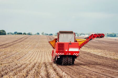 tractors working in the fieldの写真素材