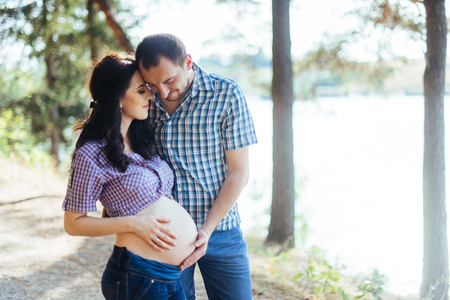 Happy family is waiting their babyの写真素材