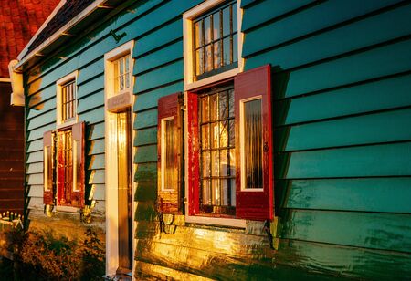 Comfortable houses at sunset. Beautiful traditional wooden  in Hollandの写真素材