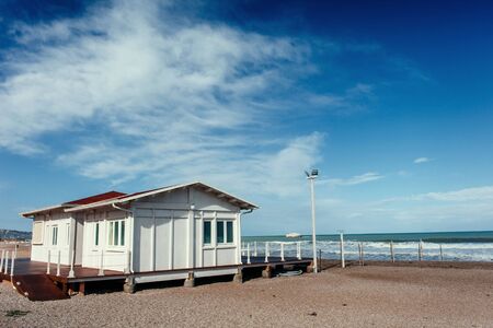 Small white cottage by the seaの写真素材