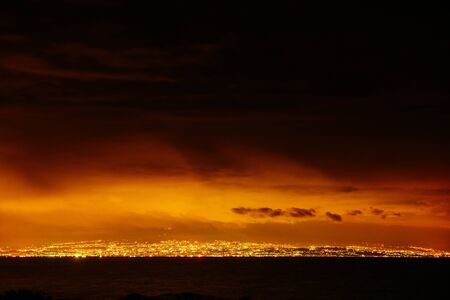 city with a night on the beachの写真素材