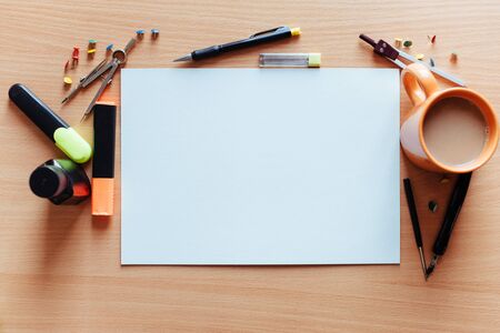 white empty sheet with lots of stationery objects makesの写真素材