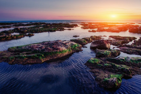 Spring view of the coast at sunset city Trapani.