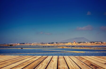 Blue sky over the sea. Dramatic Rocky Mountainsの写真素材