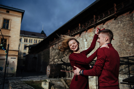 Happy couple in love on the streets of the cityの写真素材