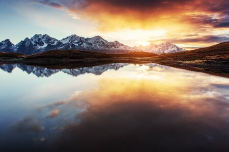 Sunset on mountain lake Koruldi. Upper Svaneti, Georgia, Europe.の写真素材