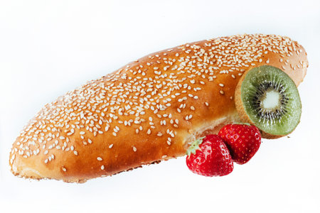 bun sprinkled with sesame seeds on a light background. insulatioの写真素材