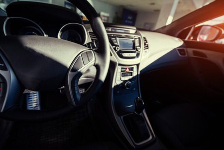 Modern car interior dashboard and steering wheelの写真素材