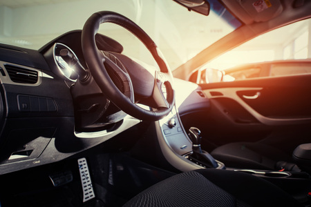 Modern car interior dashboard and steering wheelの写真素材