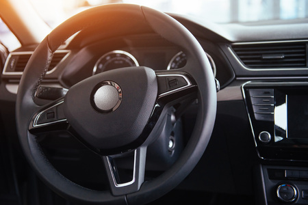Modern car interior dashboard and steering wheelの写真素材