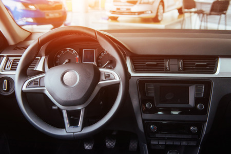 Modern car interior dashboard and steering wheelの写真素材
