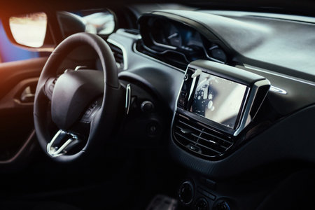 Modern car interior dashboard and steering wheel