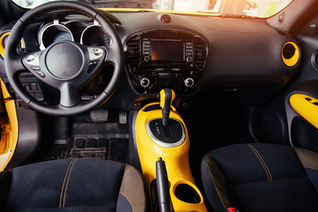 Modern car interior dashboard and steering wheelの写真素材
