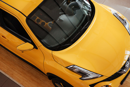 of the car in the spacious showroom with large windowsの写真素材