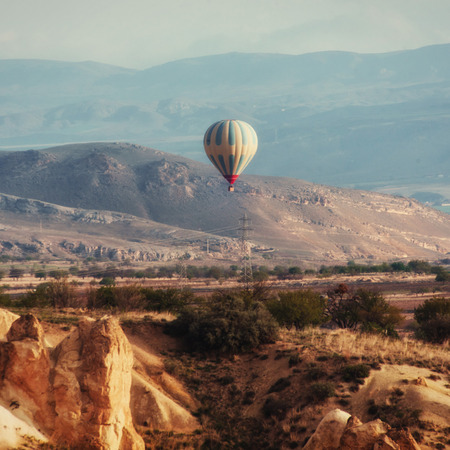 Colorful hot air balloons flying over Red valley at Cappadocia,の写真素材