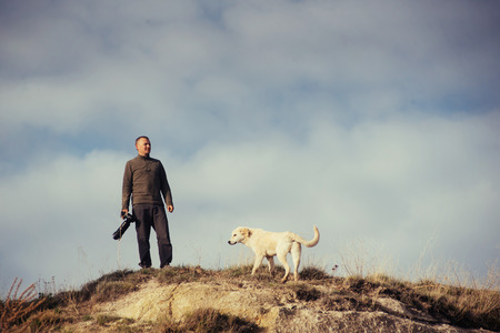 Photographer sandstone cliff and observing the natural landscapeの写真素材
