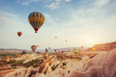 Turkey Cappadocia beautiful balloons flight stone landscapeの写真素材