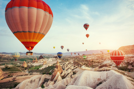 Turkey Cappadocia beautiful balloons flight stone landscapeの写真素材