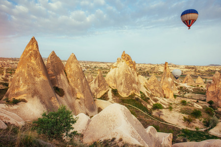 Turkey Cappadocia beautiful balloons flight stone landscapeの写真素材