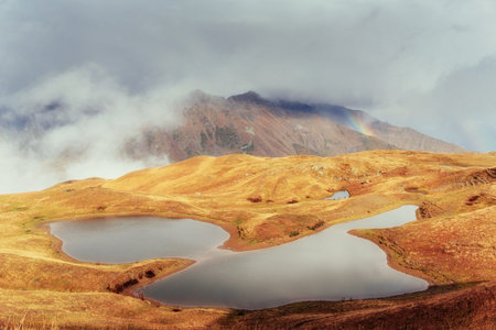 Sunset on mountain lake Koruldi. Upper Svaneti, Georgia, Europe