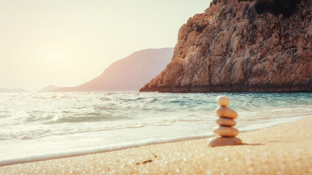 Scenic view of sandy beach and surf waves on the shoreの写真素材