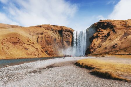 Great waterfall Skogafoss in south of Iceland near the town of Skogar. Beautiful autumn landscape.の写真素材