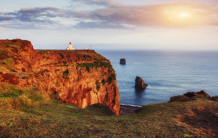 Beautiful white lighthouse at Cape Dyrholaey, South Icelandの写真素材