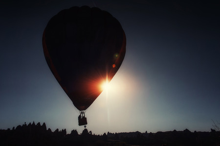 Amazing sunset over Cappadocia. Beautiful color balloons. Turkeyの写真素材