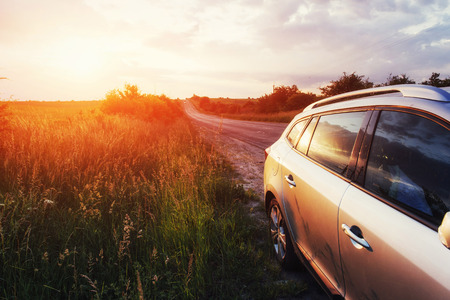 road car on a field at sunset. Ukraine Europeの写真素材
