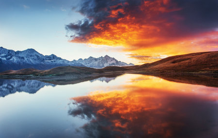 Sunset on mountain lake Koruldi. Upper Svaneti, Georgia, Europe.