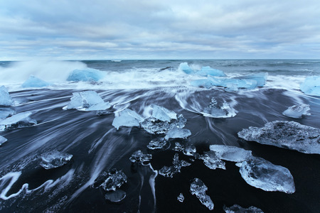 Jokulsarlon glacier lagoon, fantastic sunset on the black beach,の写真素材