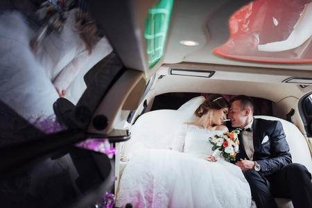 Happy man and woman smiling rejoicing in wedding day.の写真素材
