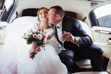 Happy man and woman smiling rejoicing in wedding day.の写真素材