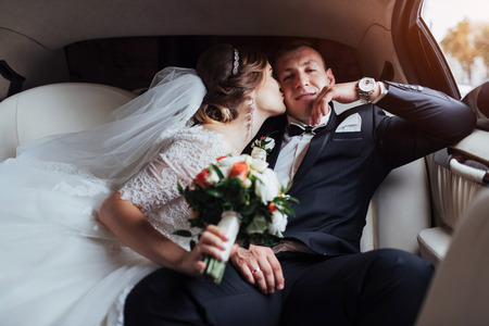 Happy man and woman smiling rejoicing in wedding dayの写真素材
