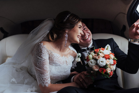 Happy man and woman smiling rejoicing in wedding dayの写真素材