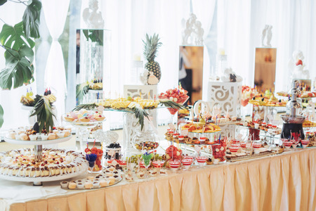 Banquet table full of fruits and berries an assortmentの写真素材
