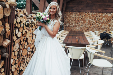 Portrait of gorgeous bride with a wedding bouquetの写真素材