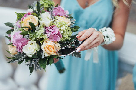 Portrait of gorgeous bride with a wedding bouquetの写真素材