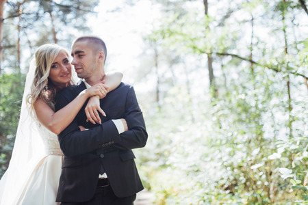 groom at a park on their wedding dayの写真素材
