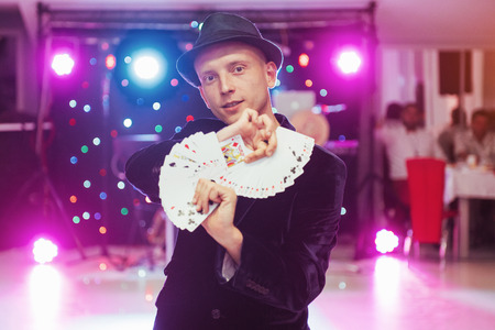Magician showing trick with playing cards. Magic, circusの写真素材