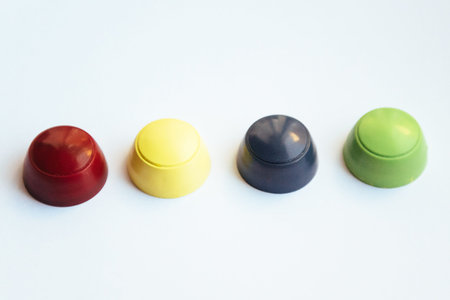 Colored plastic caps isolated on white background